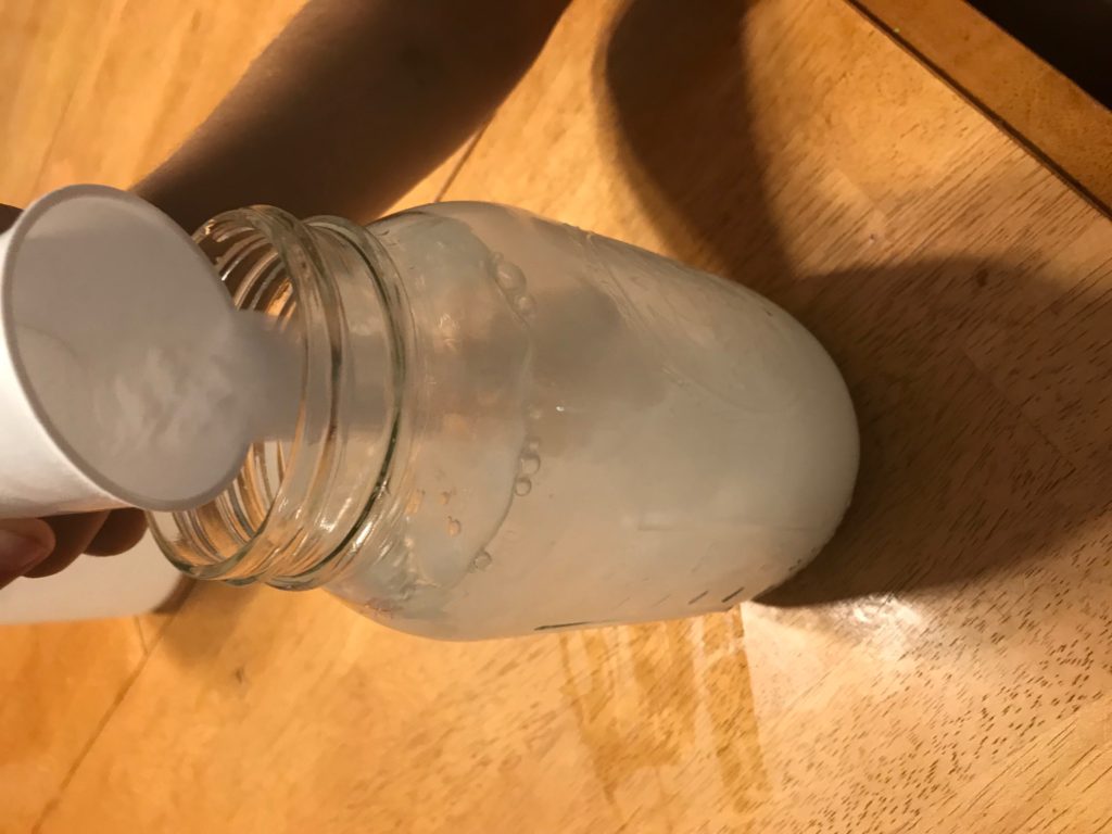 Jar with vinegar and baking soda