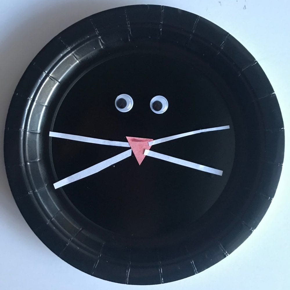 black paper plate cat face
